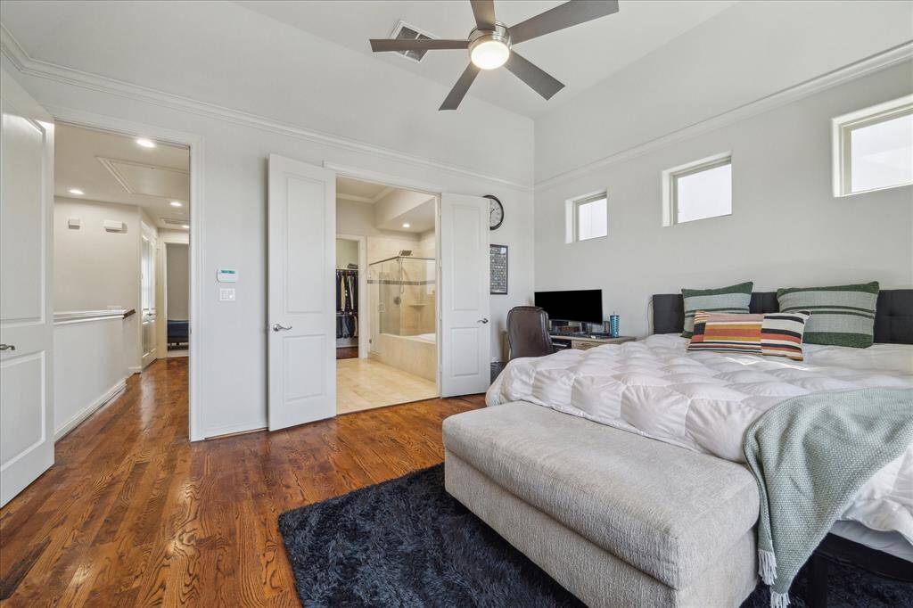 View of the primary suite showing the bathroom and hallway.
