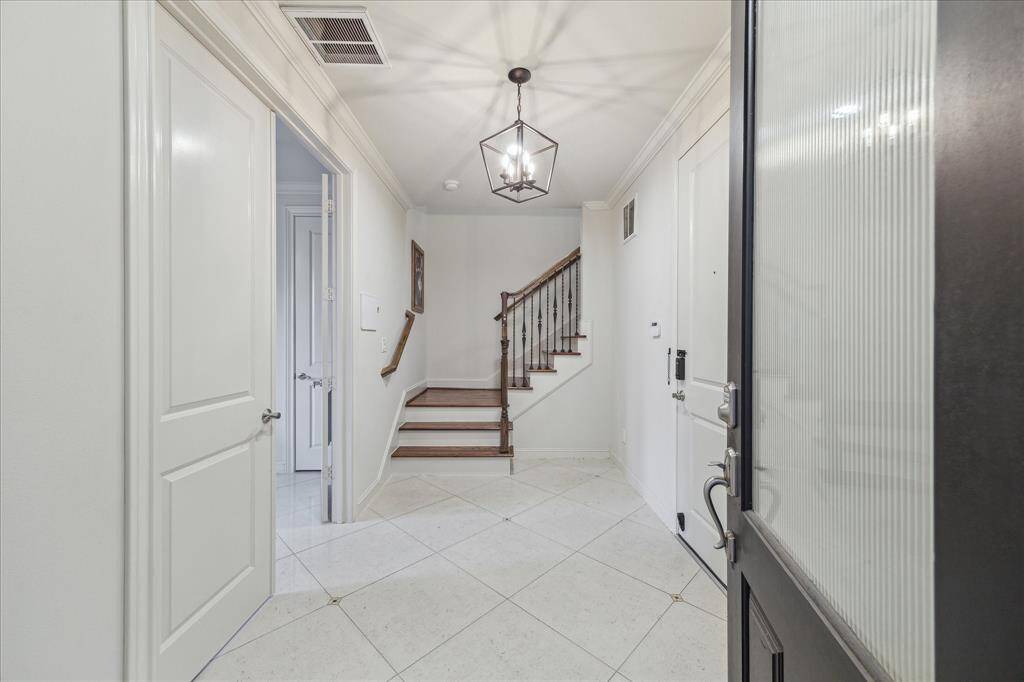 Entry with marble floors, with one bedroom down.