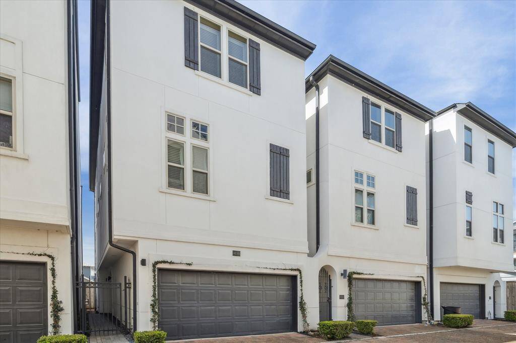 View of the home on the shared driveway. HOA covers landscaping and private trash pick-up.