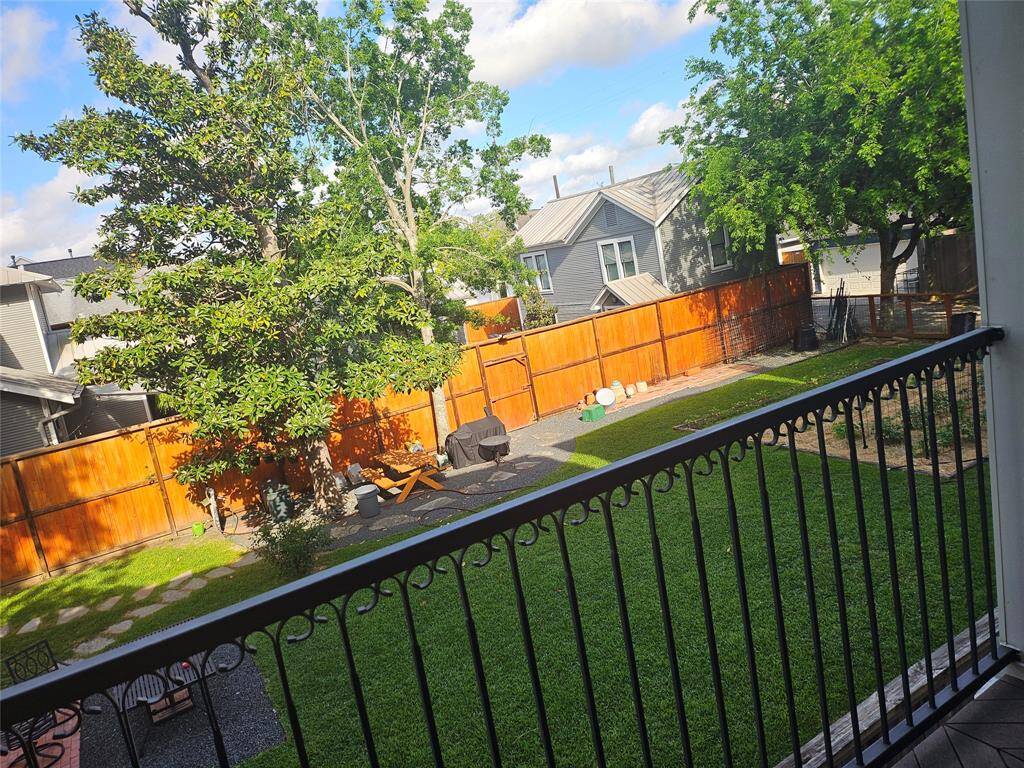 View of the neighbor's private property behind the home with a well manicured garden. Provides beautiful views and added natural light.
