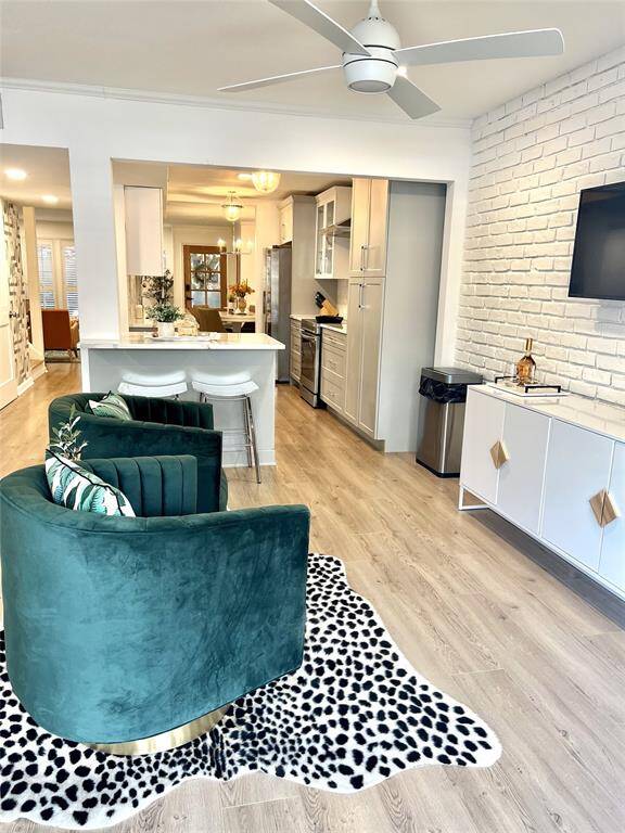 Two living spaces with dining and kitchen in between.