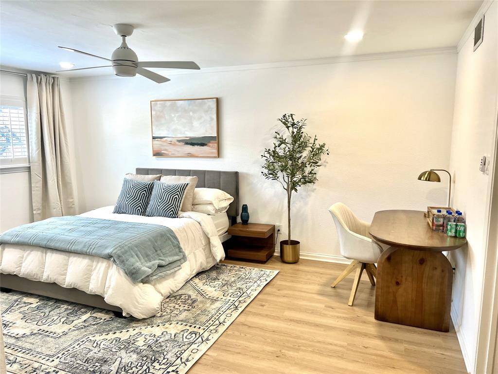 Bedroom at the back of the house on the 2nd floor.  Also spacious, attached full bathroom and walk in closet.