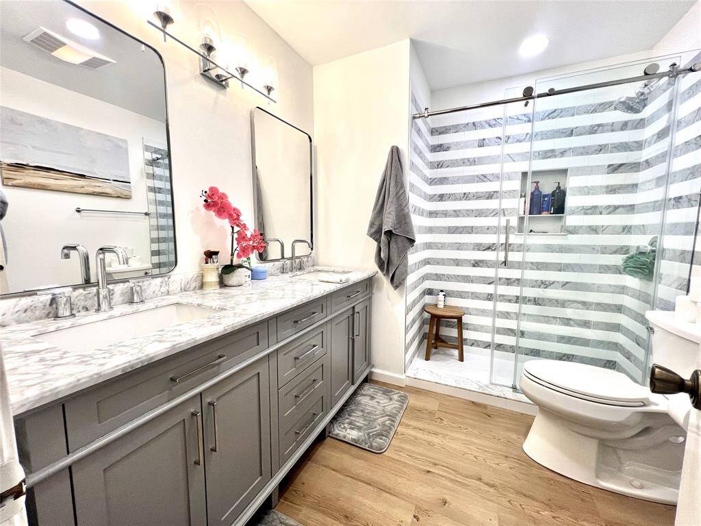 Full bathroom with huge walk-in shower, dual sinks.  Ensuite to bedroom upstairs.