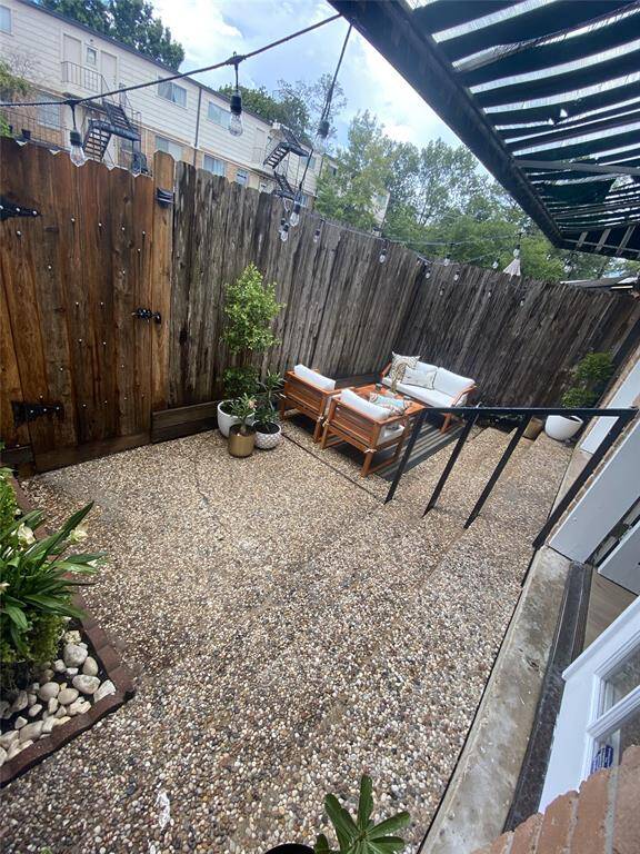 Private patio, off study and sitting area.  Through the gate are 2 private assigned parking spaces.