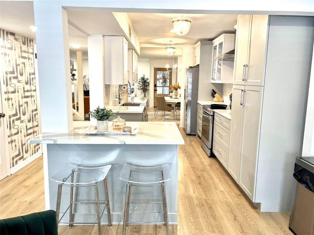Spectacular kitchen - layout, finishes, storage and counter space.  Breakfast bar and wood floors throughout the living level.
