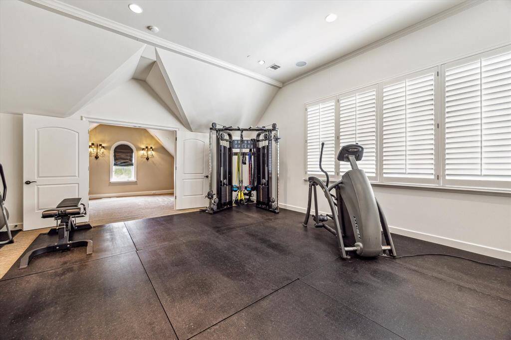 The versatile second floor game room, currently being utilized as a workout space.
