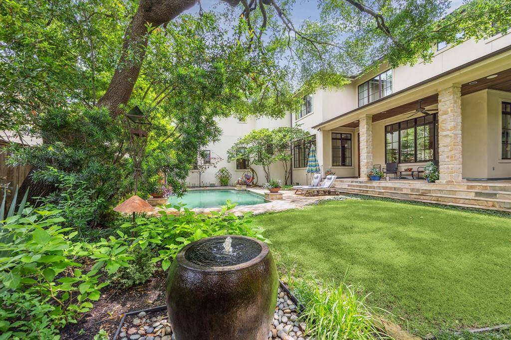 The fabulous backyard is a great place to take a dip, relax on the covered patio or the pool terrace. Views of the backyard are enjoyed from almost every room in this truly elegant home.