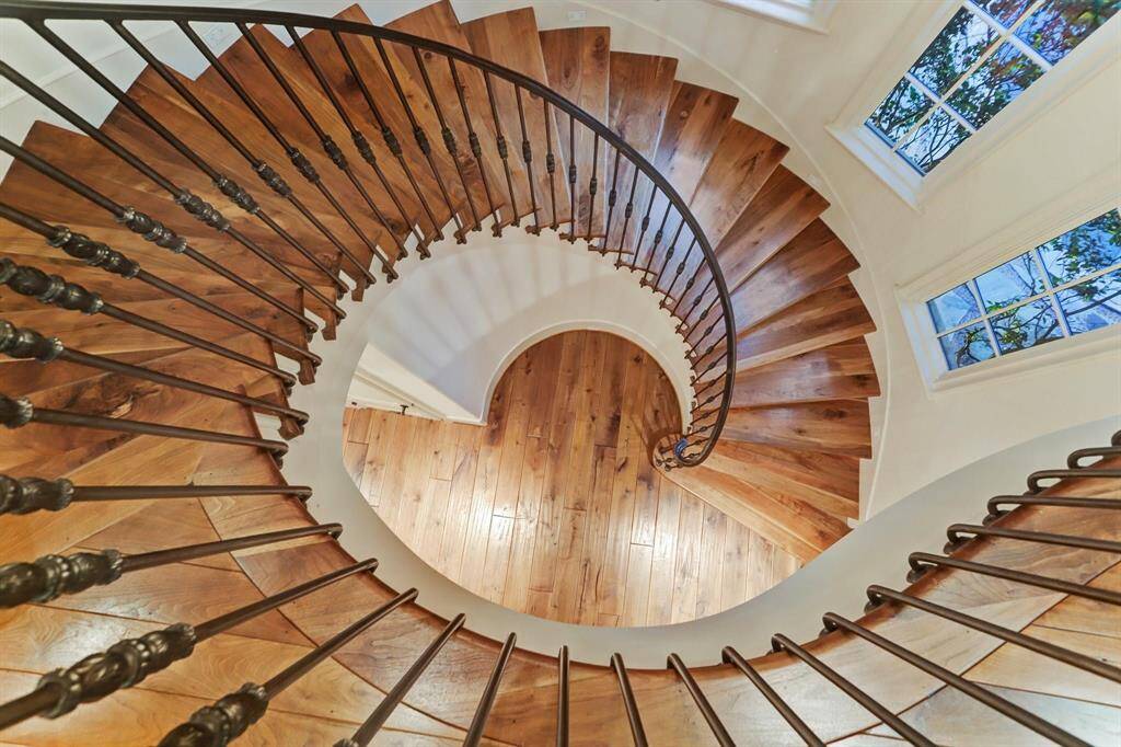 Architecturally stunning, simple and elegant staircase. Night lighting on the lower side walls. Domed ceiling with chandelier and rope lighting only enhances the true elegance of this staircase.