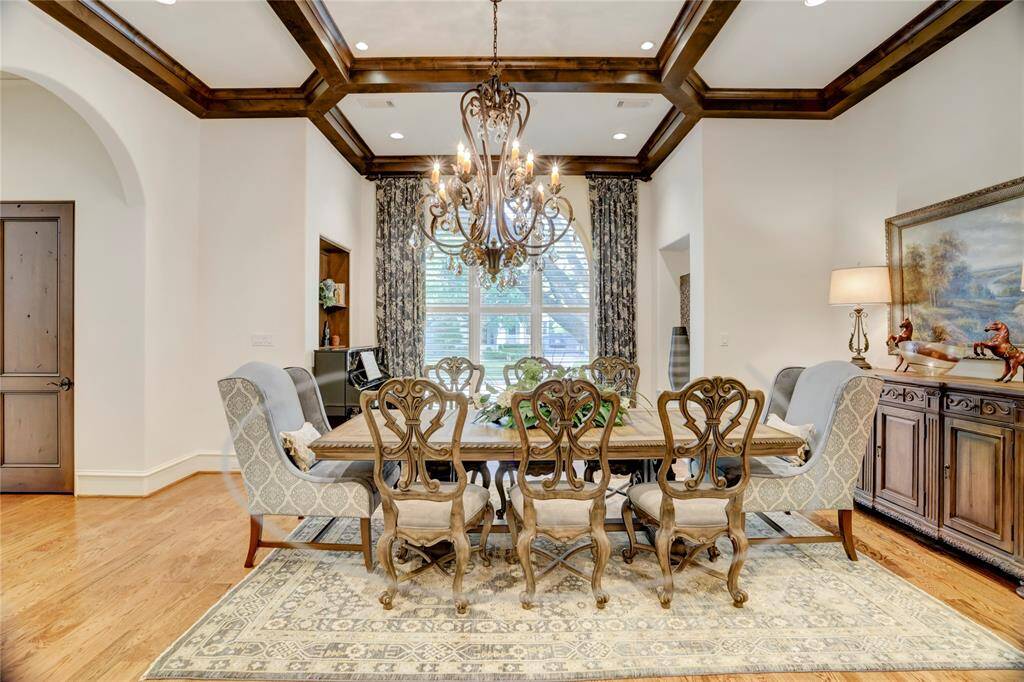 Boxed beam ceiling in dining room with abundant natural light