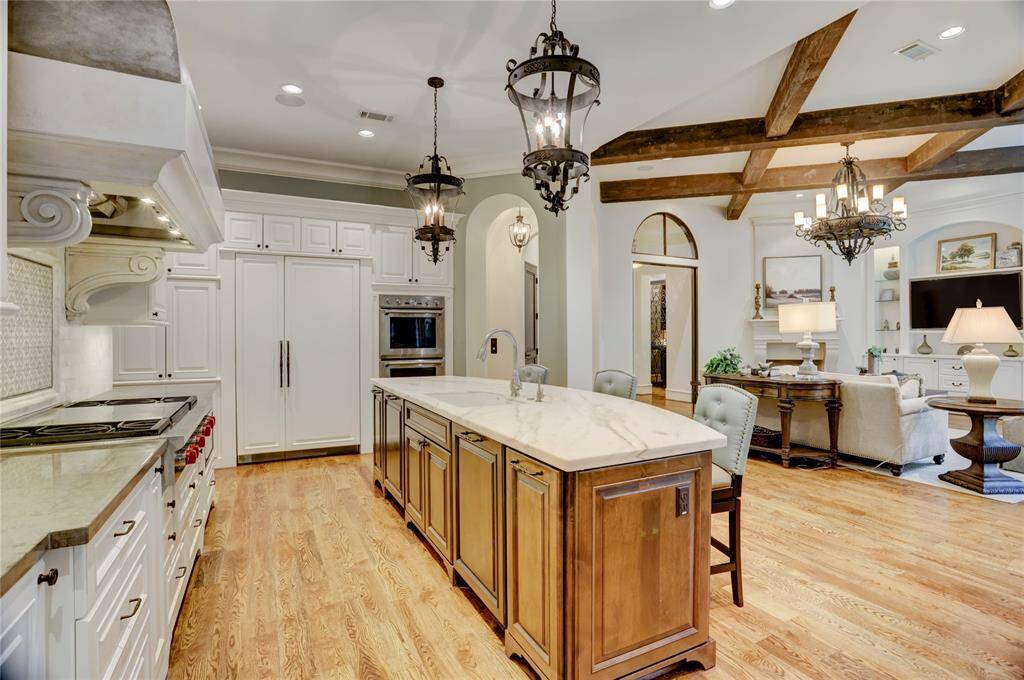 Calacutta Marble kitchen island counter and Lagos Azul (limestone) countertopsin kitchen and pantry