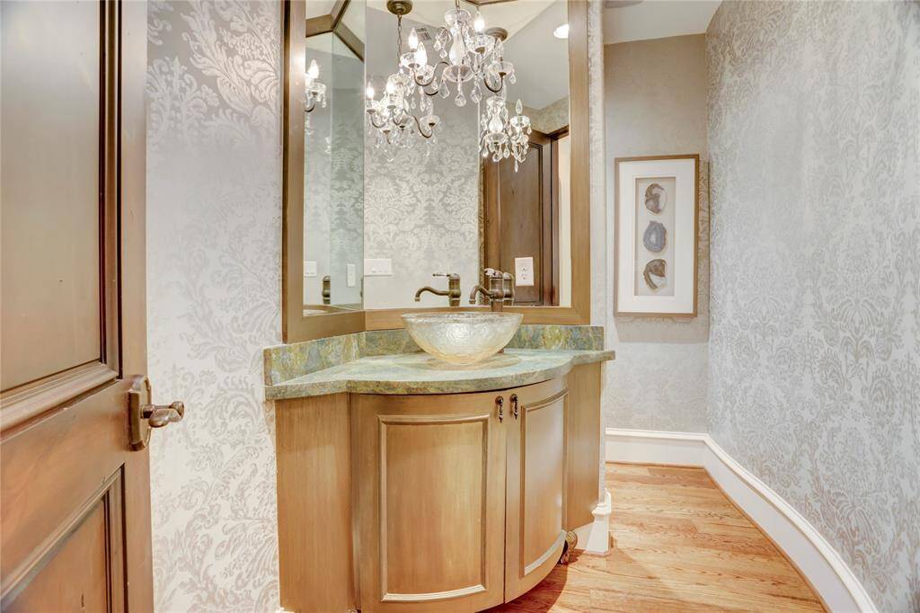 Jewel-box powder room in first floor with crystal chandelier