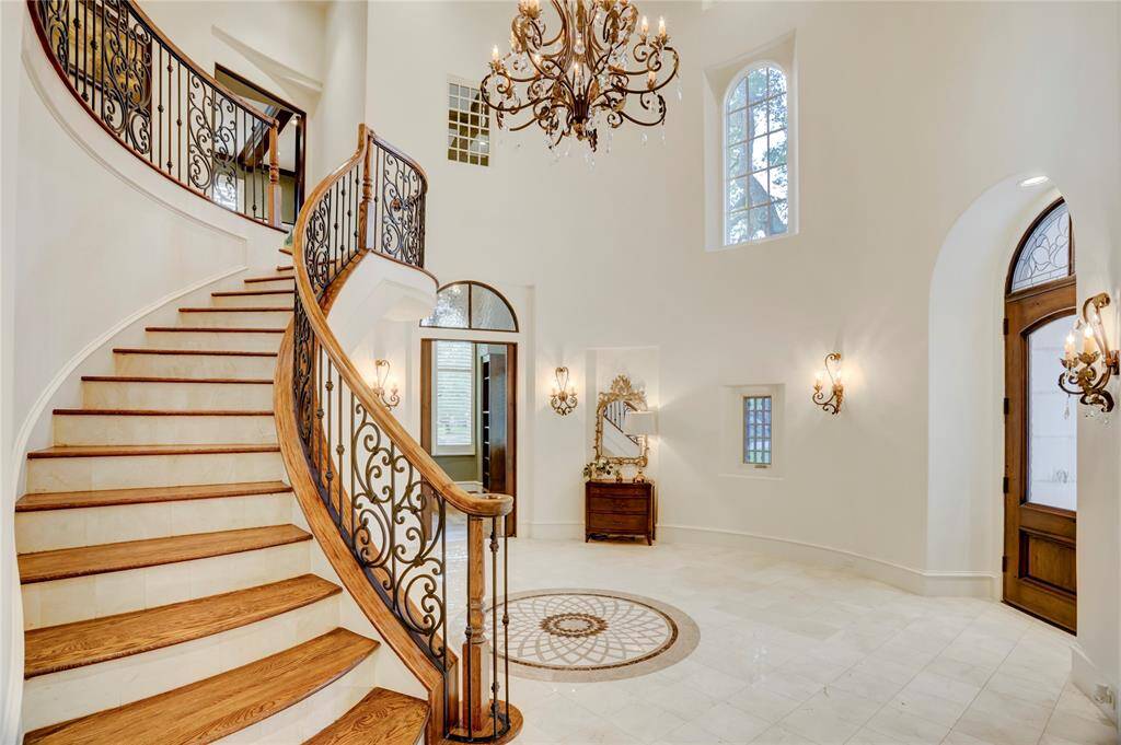 Leaded glass transoms throughout first floor, stairs leading to the second floor