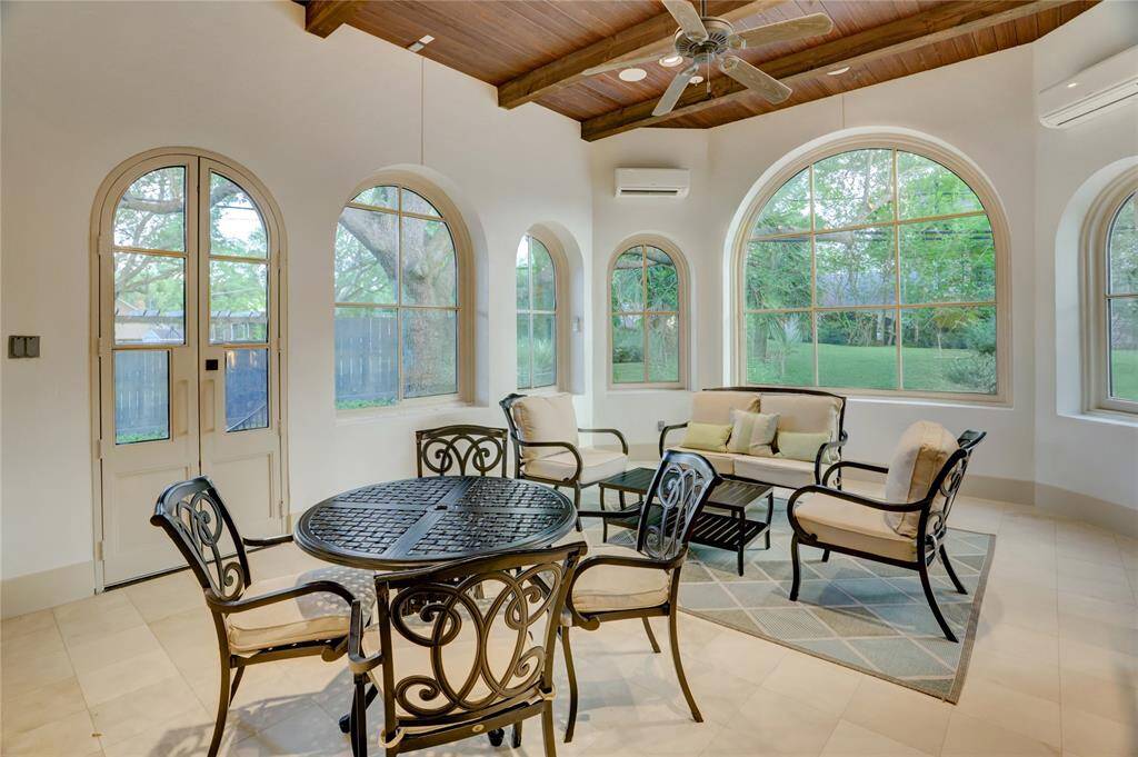 Large enclosed air-conditioned loggia with full summer kitchen and largePalladian windows