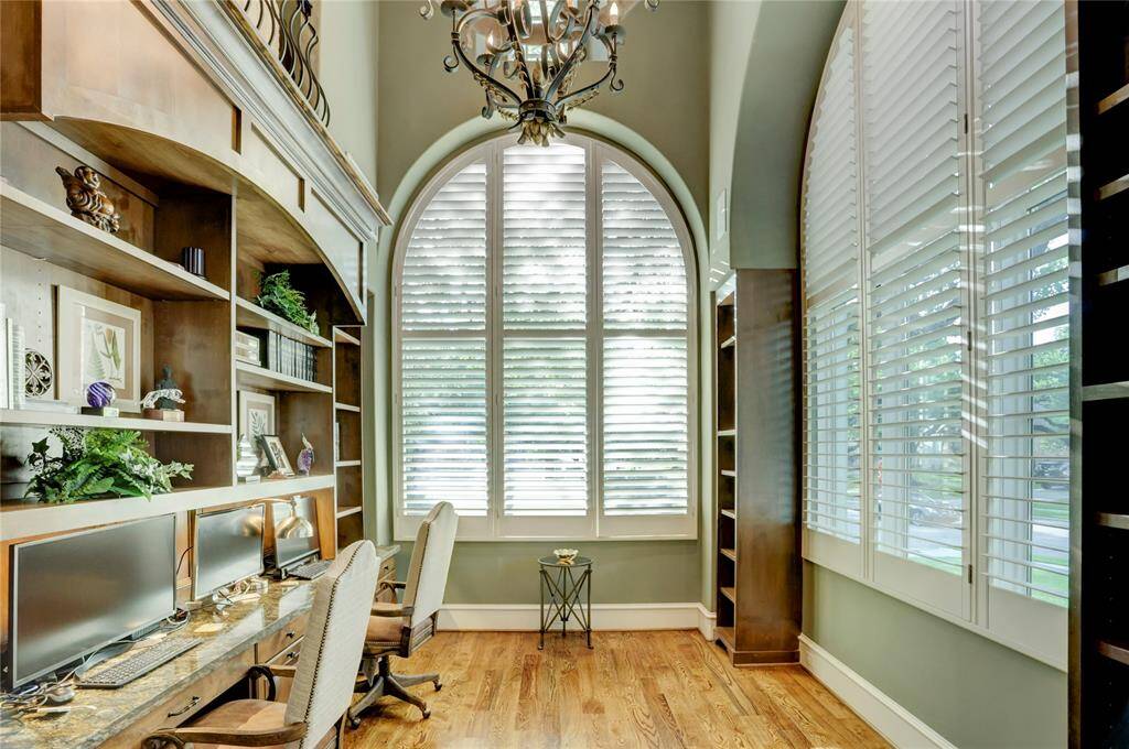 Classic Tuscan-style iron and crystal chandeliers in study