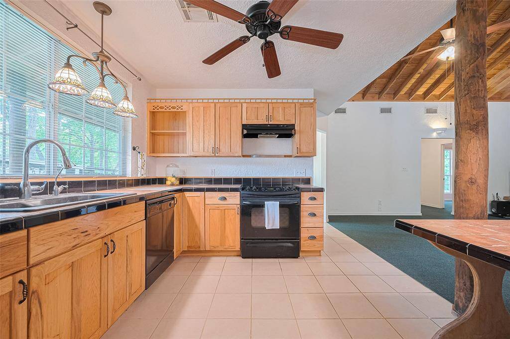 This kitchen boasts plenty of room to store everything you need and ample workspace for preparing meals.