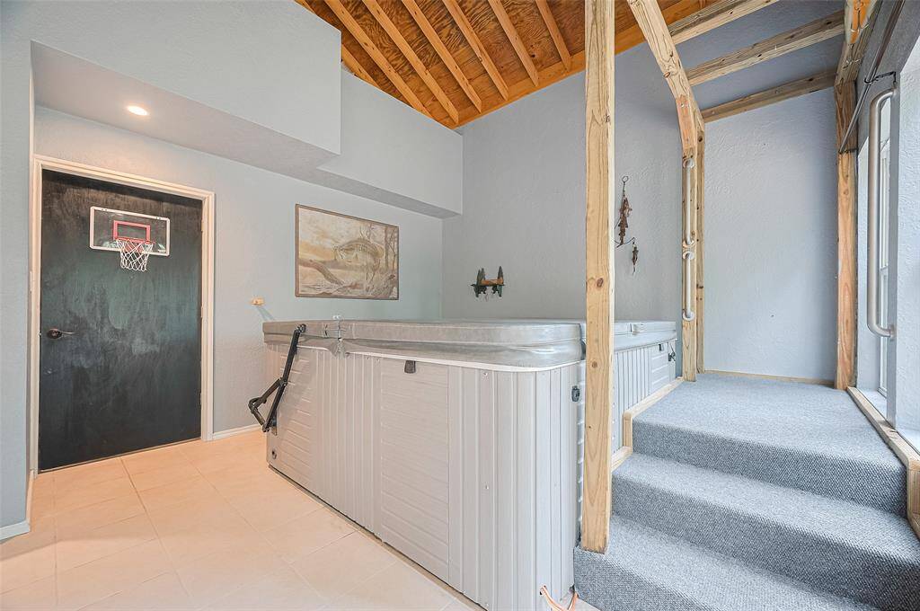 Complete with a hot tub and access to the back deck.