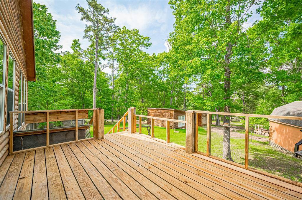 A spacious back deck, perfect for sunny days and enjoying a lake view.