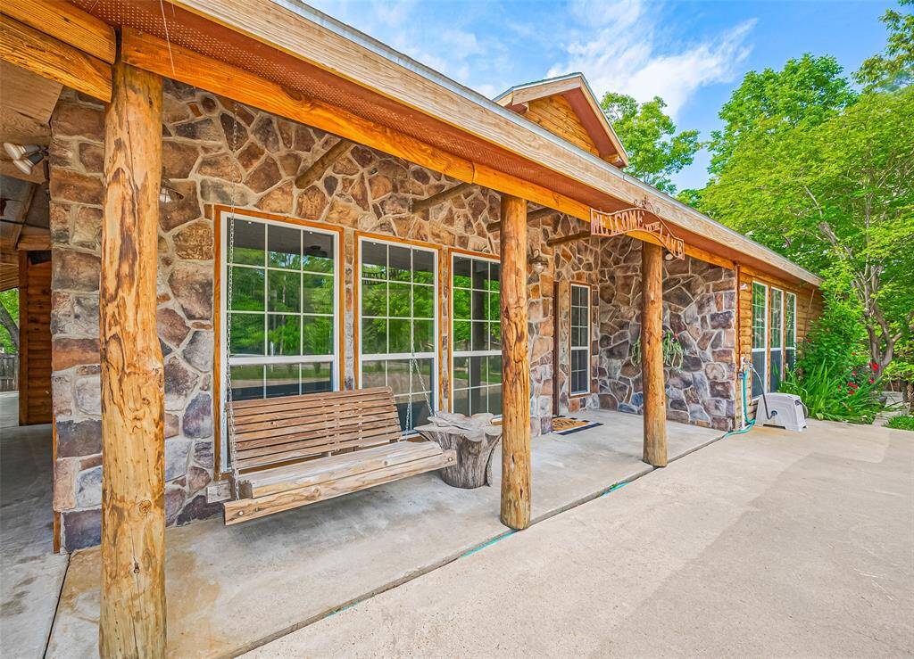 Enjoy peaceful moments on the inviting front porch swing.