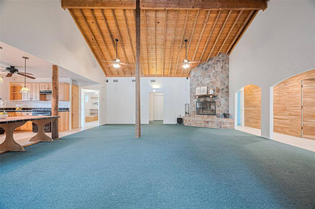 High ceilings are a key feature that enhances the open and airy feel of the main living area.