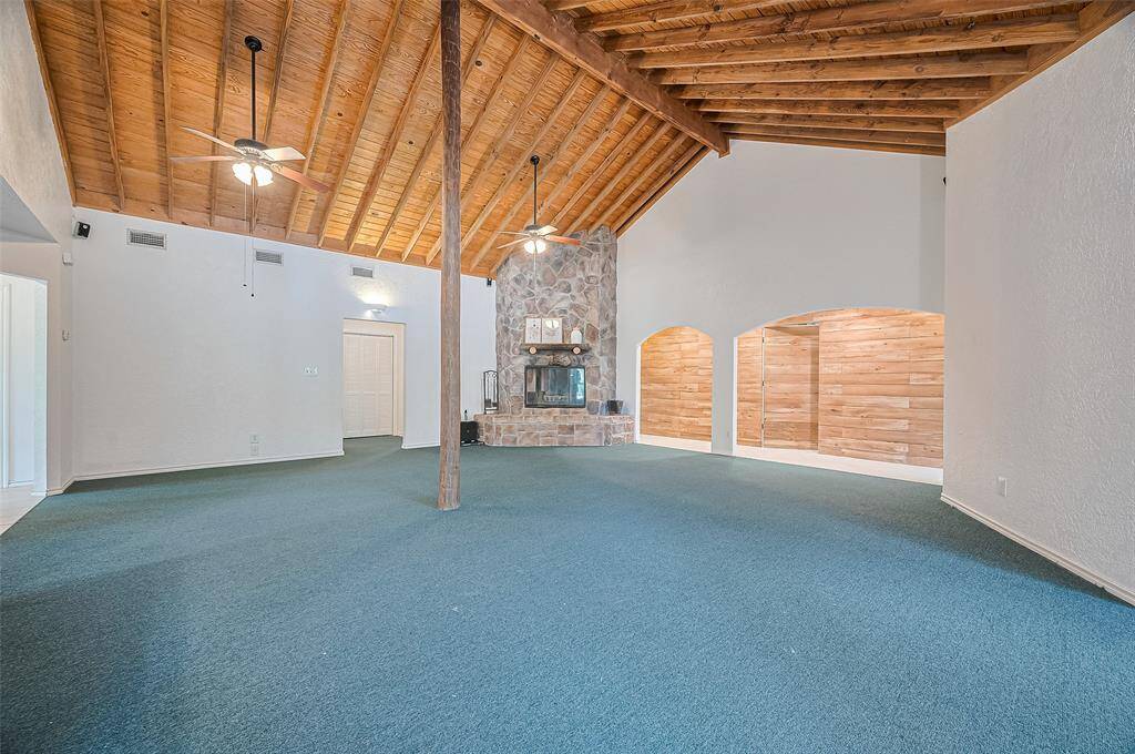 A beautiful fireplace creates a sense of comfort and belonging at the heart of this home.