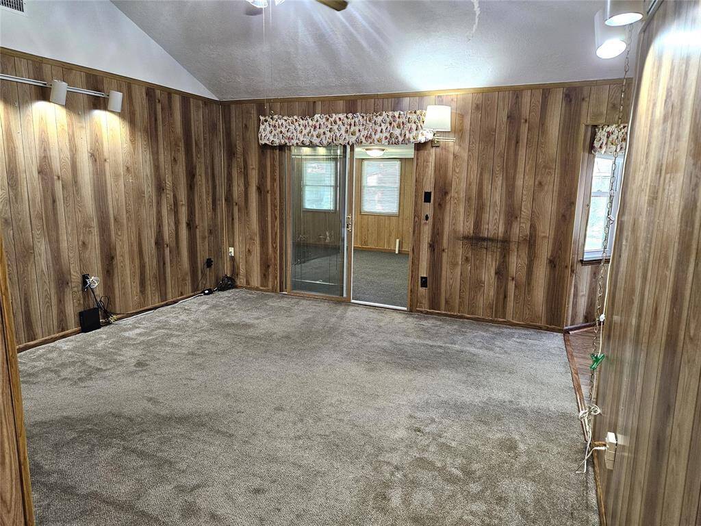 The living room has vaulted ceilings is the hub of the home.
