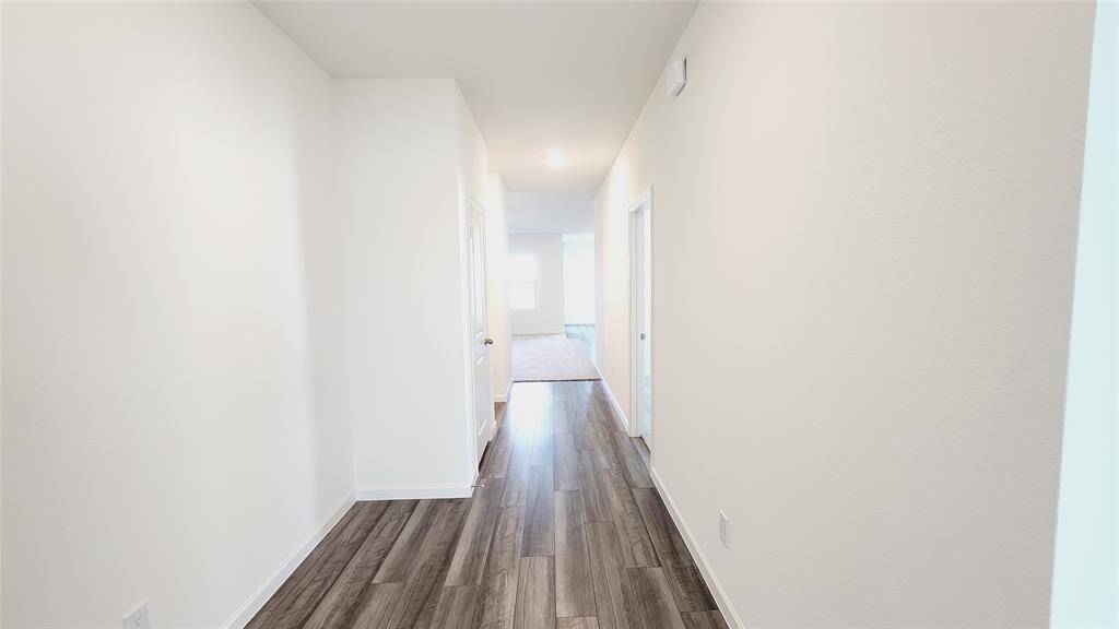 Representative photo - foyer to family room & kitchen