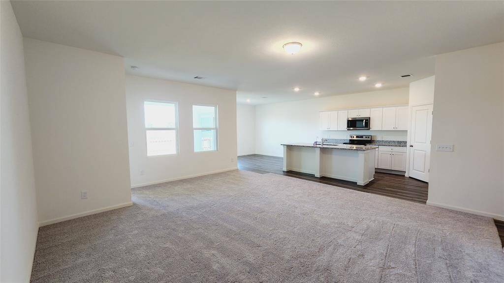 Representative photo - family room to kitchen