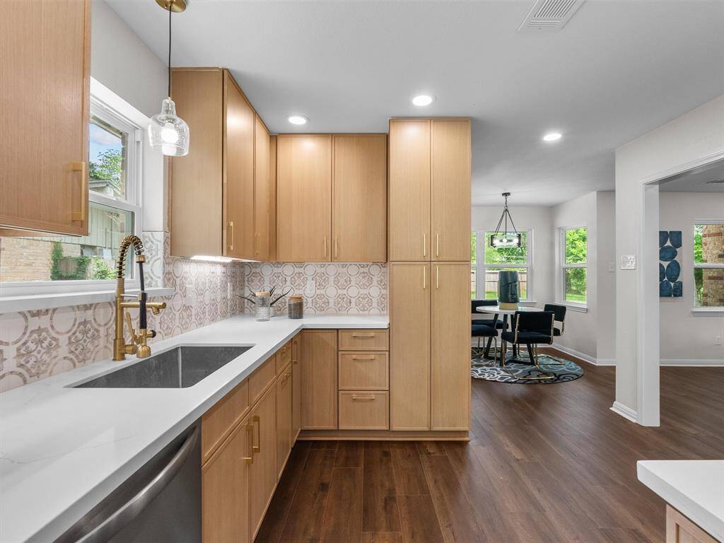 All new elegant cabinetry, lighting, countertops, fixtures, and backsplash await you!