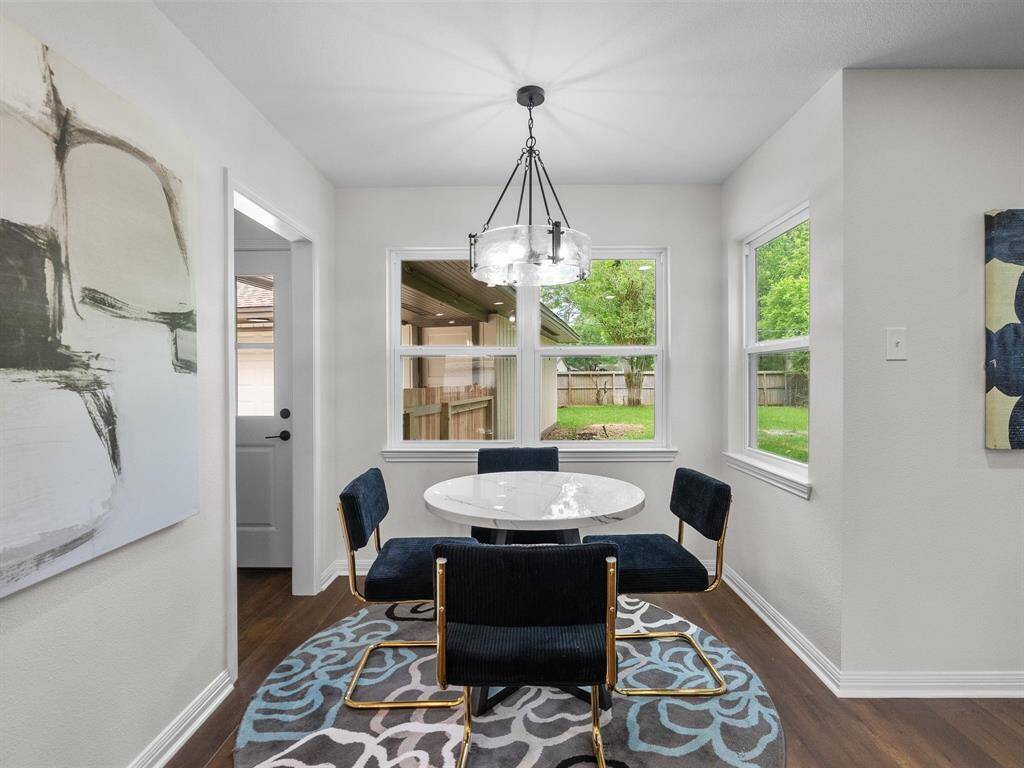 The breakfast area with ample windows has a great view of the peaceful backyard.