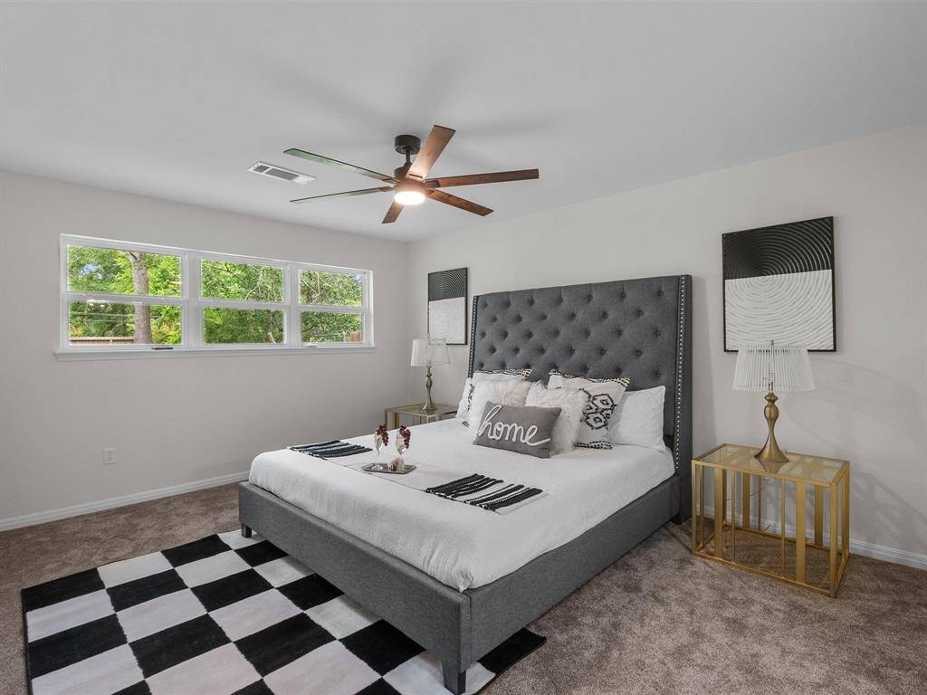 The substantial primary suite has plenty of room for all your bedroom furniture!