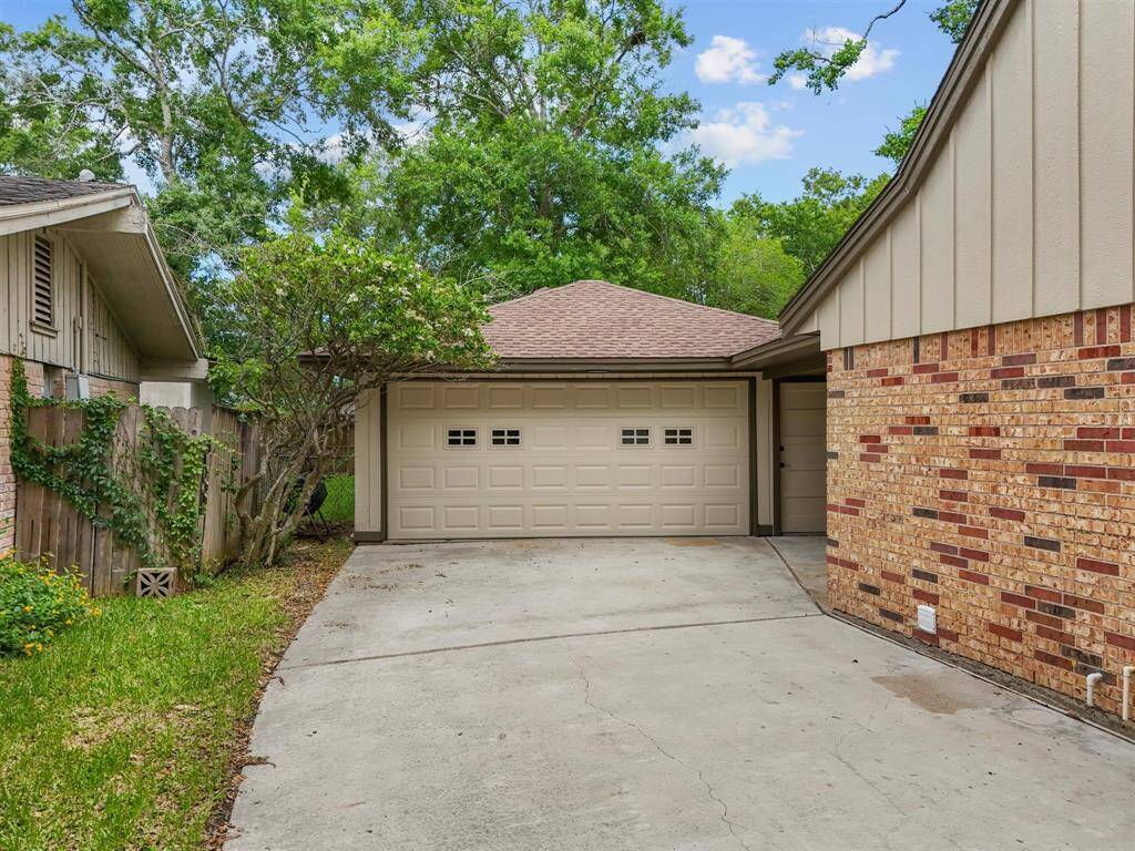 The two-car detached garage also has an additional access point and space for storage.