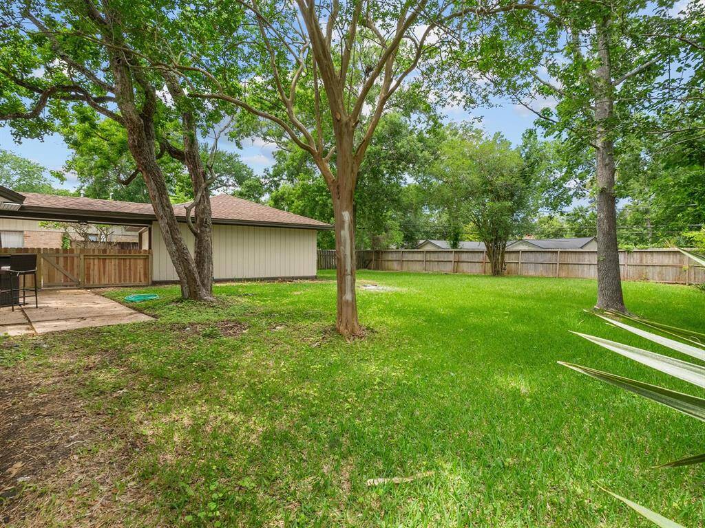 This large, fenced backyard is ready for all kinds of activities and fun--make it your own personal oasis!