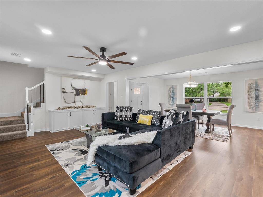Built-in cabinetry and a beautiful staircase add tasteful touches to the home.