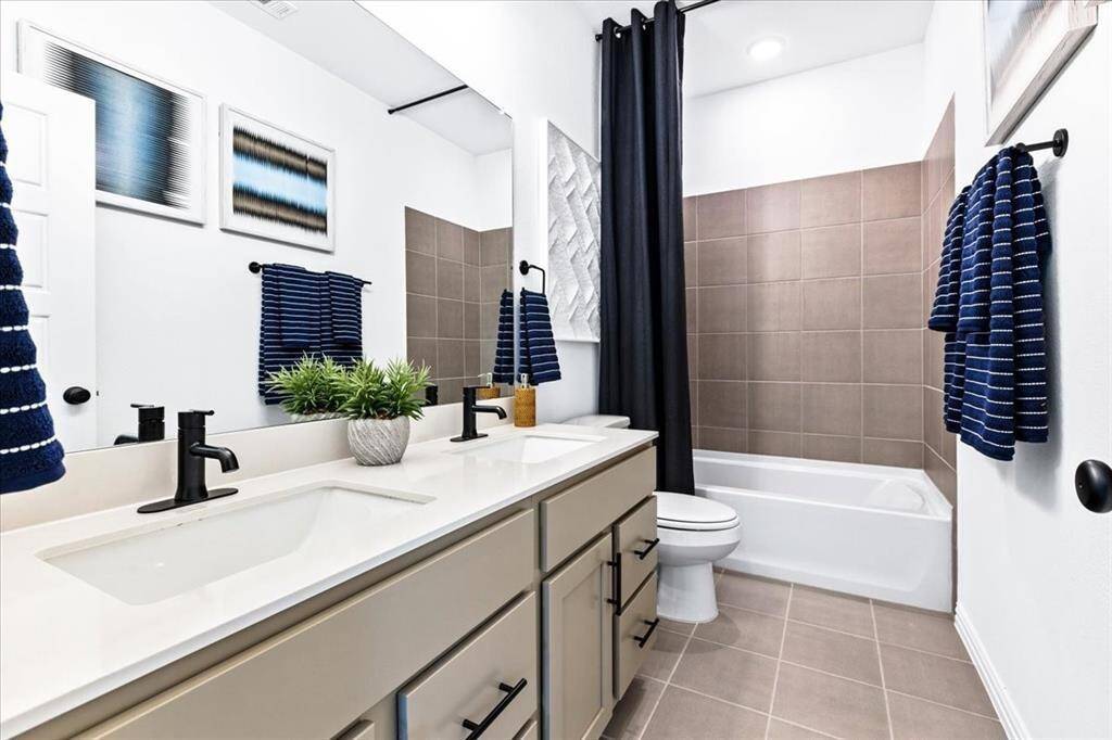 Representative photo of the Hawthorn II plan Secondary Bathroom. Shown to highlight that each bathroom is a testament to thoughtful construction, featuring sleek fixtures that not only look fabulous but also make your family's daily routine a little more enjoyable.