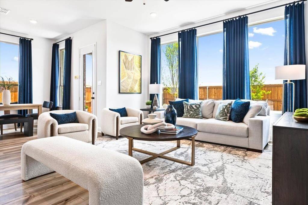Representative photo of the Hawthorn II plan Living Room. Shown to highlight the spacious layout and seamless connection to the kitchen and dining areas