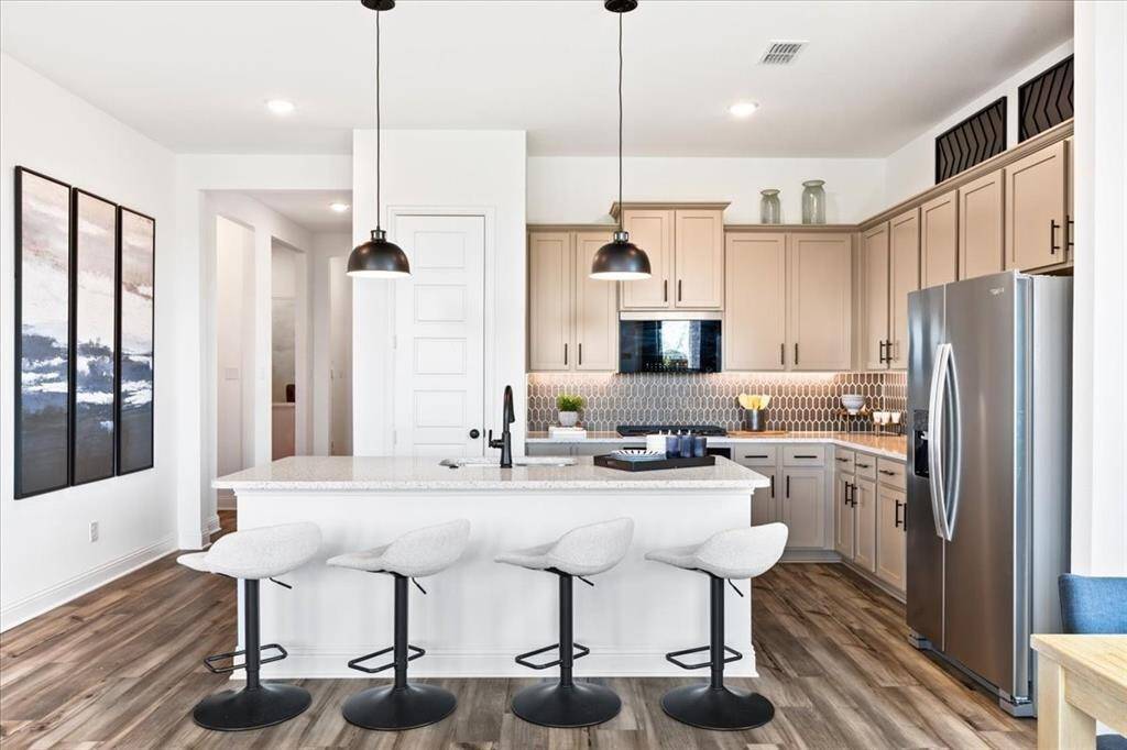 Representative photo of the Hawthorn II plan Kitchen. Shown to highlight whether you’re a seasoned chef or a novice just learning the ropes, this kitchen invites you to unleash your culinary creativity and savor every moment spent within its inviting walls.