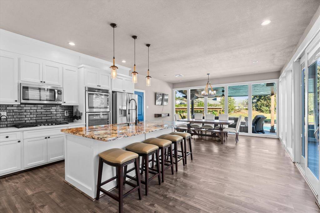 Open kitchen and dining area looking over your backyard oasis.
