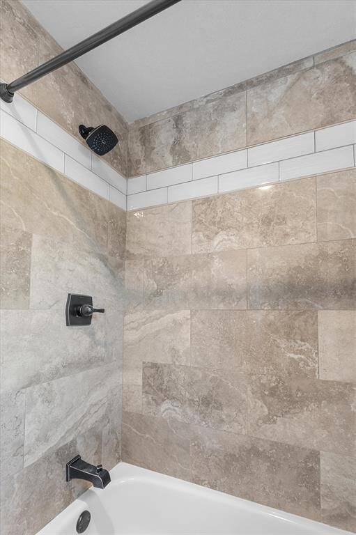 Shower/tub combo in secondary bathroom.