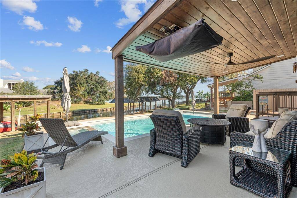 Wow, covered patio with lake and pool views!