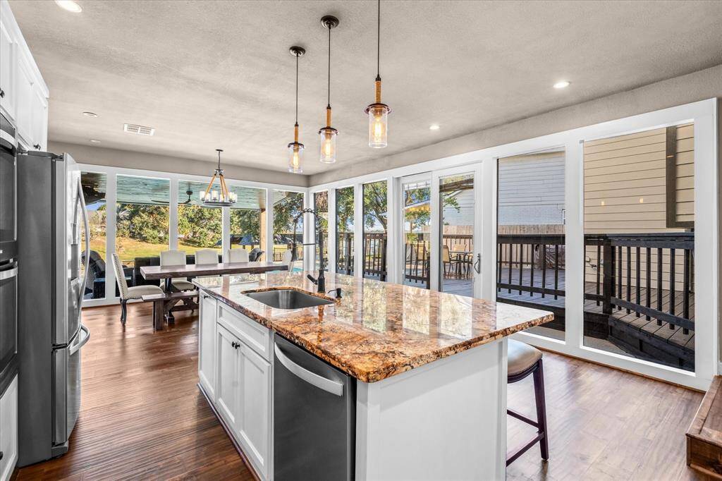 Open kitchen/dining with lake views.