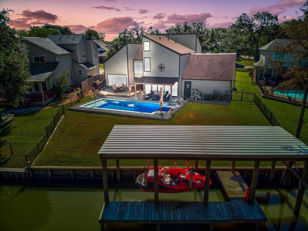 Lakefront Home with a pool, boat lift and plenty of yard space.