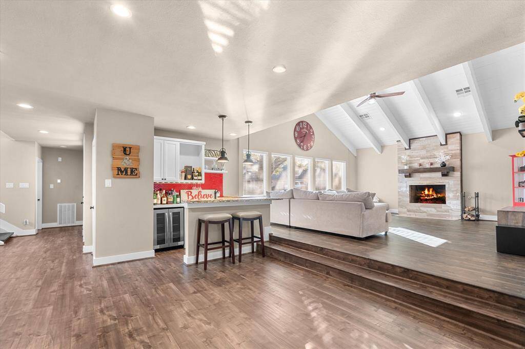 Another view of the living area with a wet bar.