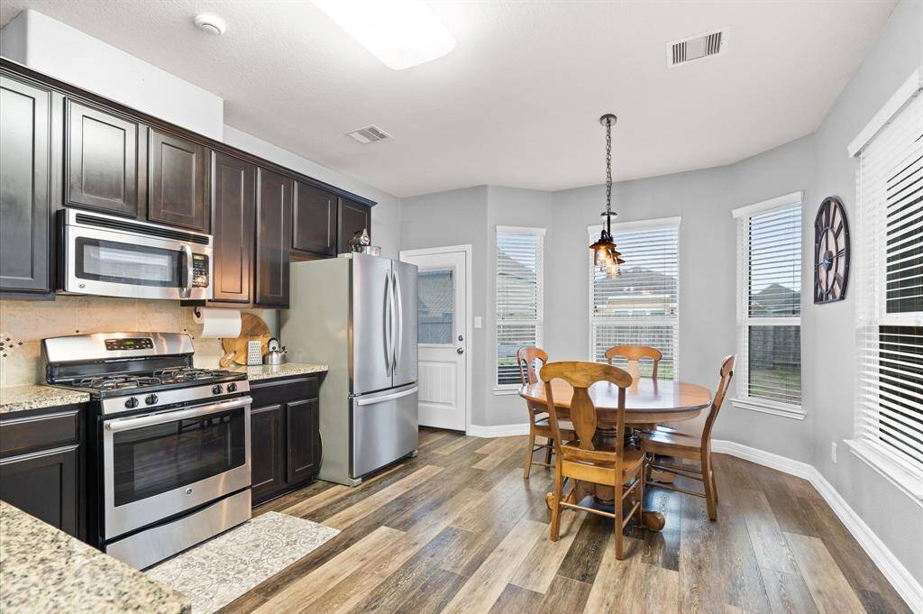 An abundance of maple cabinets and counters tops are perfect for the chef of the family.