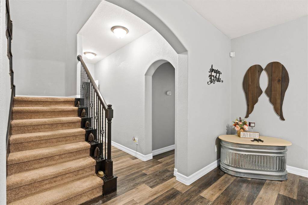 Stairs leading to the game room and 3 bedrooms and 2 baths.