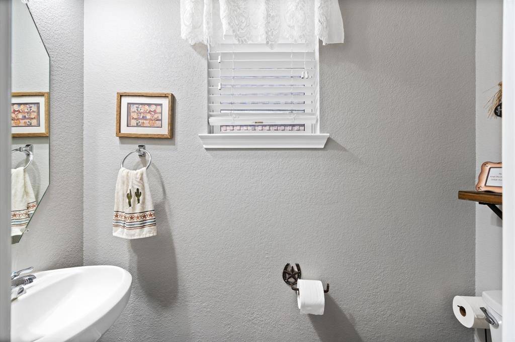 Downstairs half bath conveniently located near the living room.