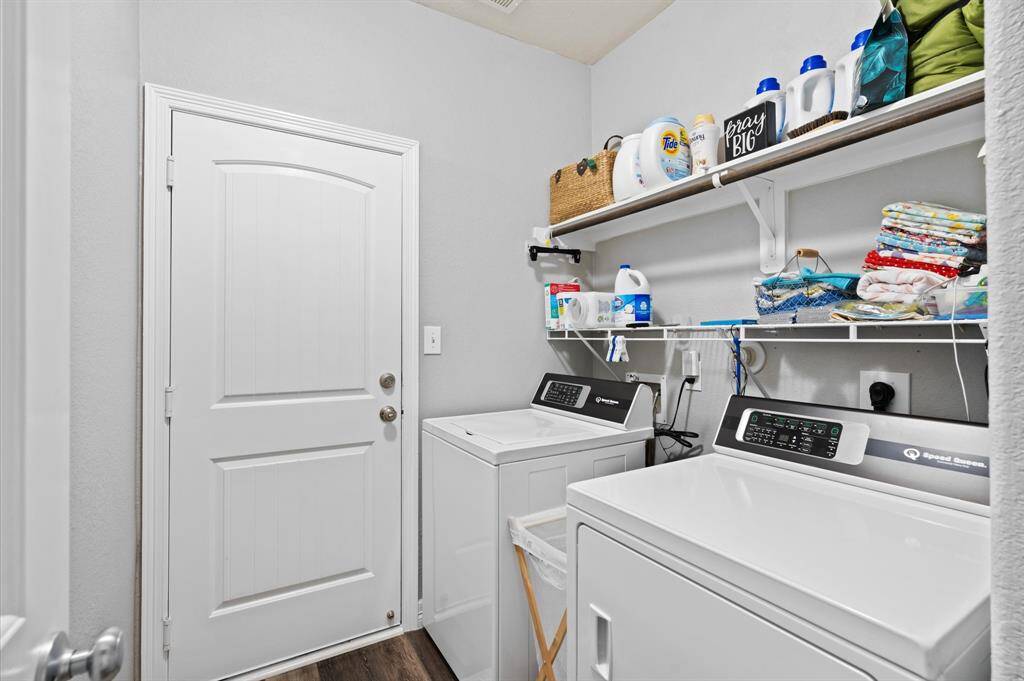 Utility room with access to garage.
