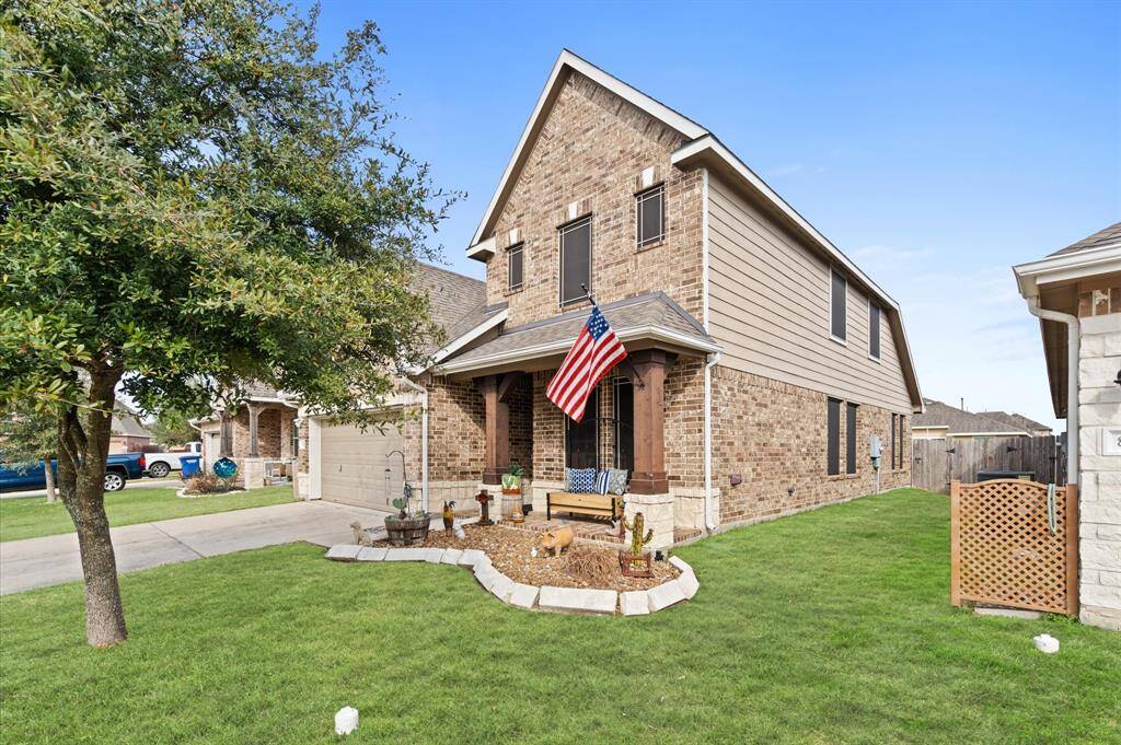 Fantastic curb appeal with covered porch and solar screens.
