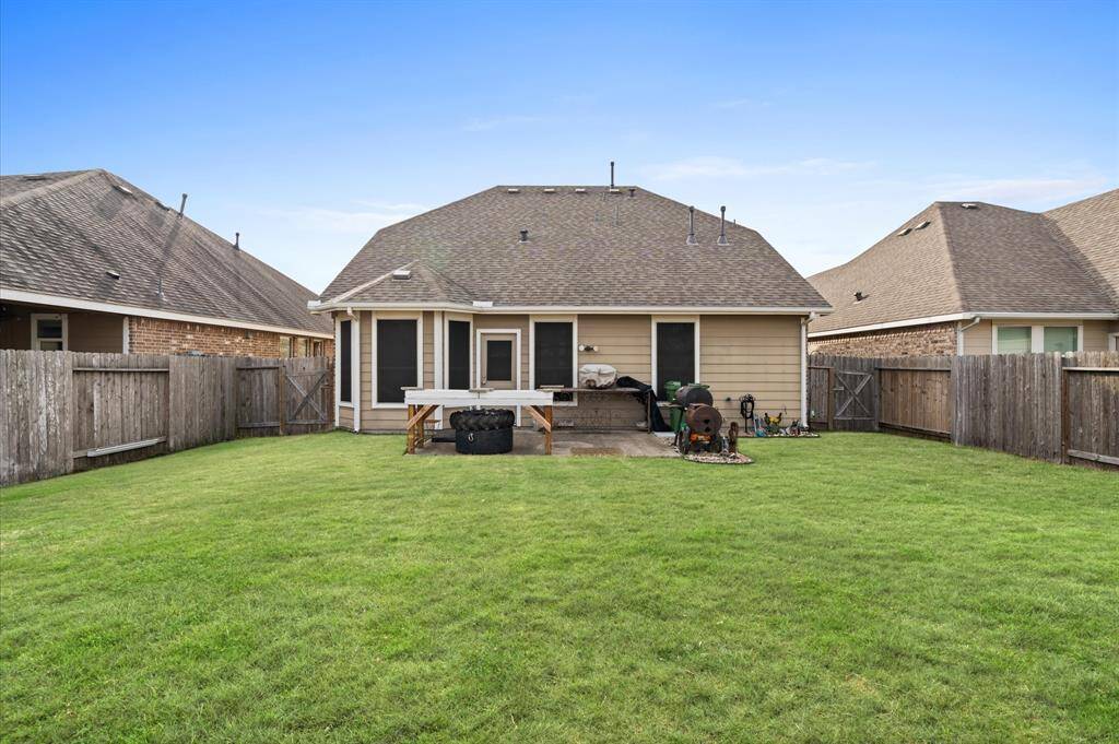 Large fully fenced backyard.