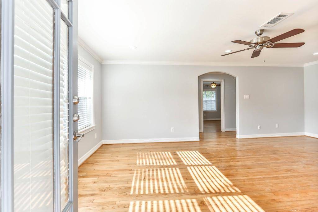 With beautiful hardwood flooring reflecting the natural light that streams in from the Low E vinyl windows...