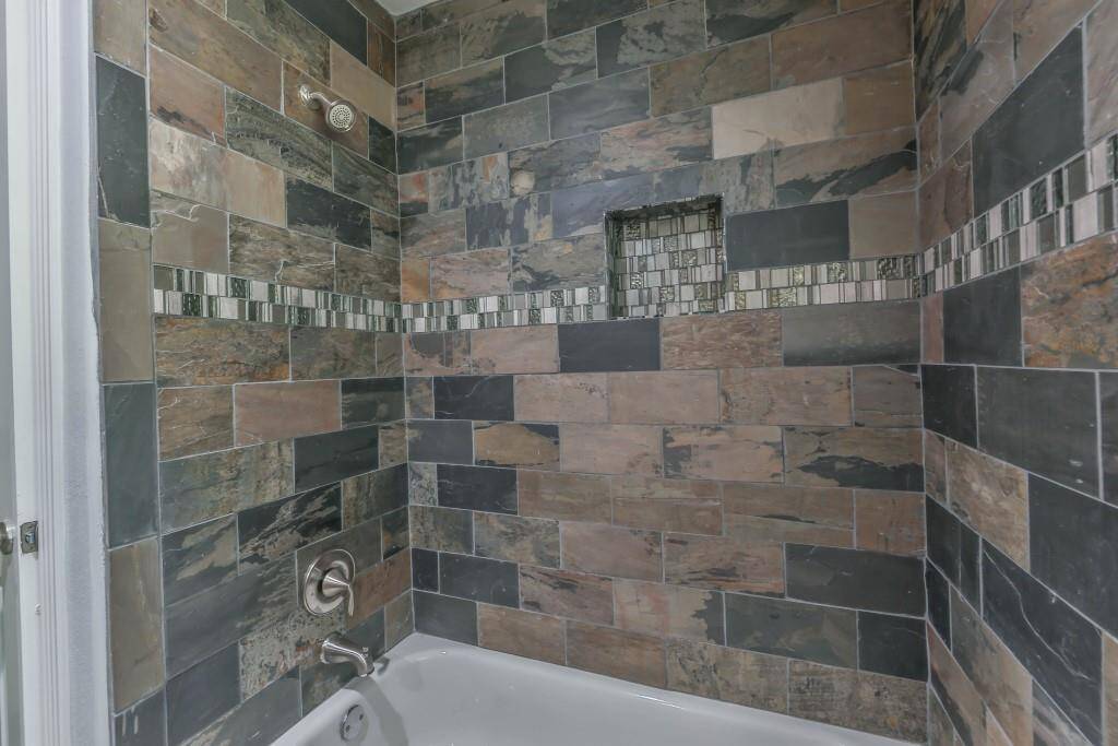 The slate surround in the hall bath...